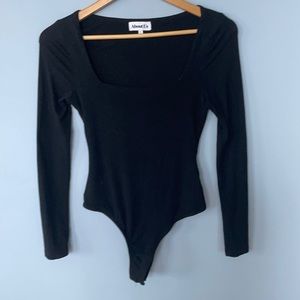 About us/ Revolve bodysuit